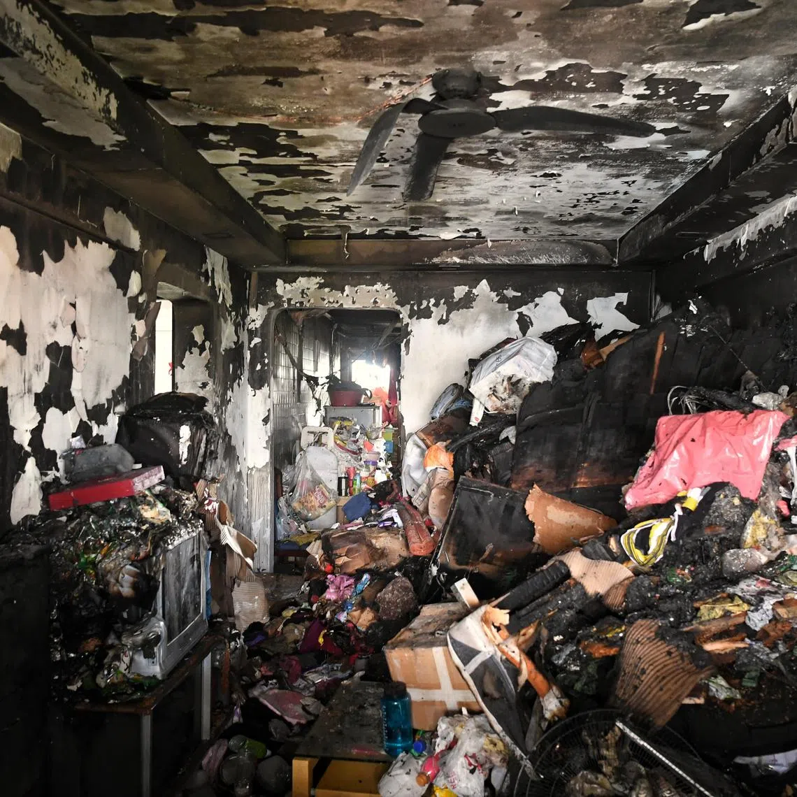 Aftermath of fatal fire at Block 456, Ang Mo Kio Ave 10 possibly due to hoarding on March 5, 2021. 2 were rescued but one died later. The Singapore Civil Defence Force said the heaps of items inside the three-room flat made it difficult for firefighters to move around after they forced their way in yesterday.