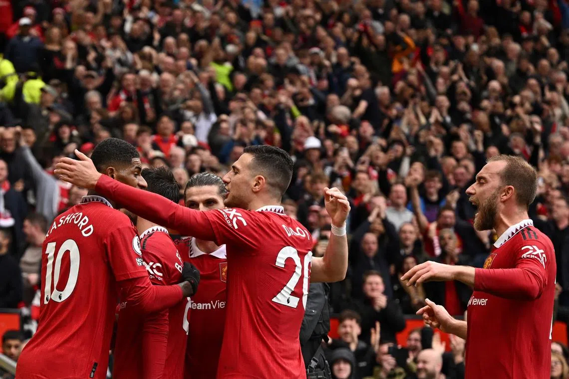 Bruno Fernandes celebrates with teammates after scoring for United.
