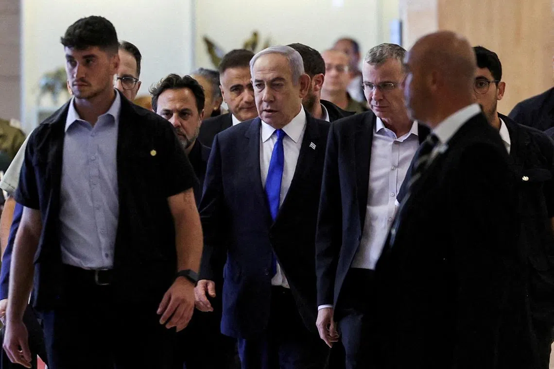 Israeli Prime Minister Benjamin Netanyahu (centre) has been accused of “failing miserably” over the war in Gaza, by a Cabinet minister who called for elections.
