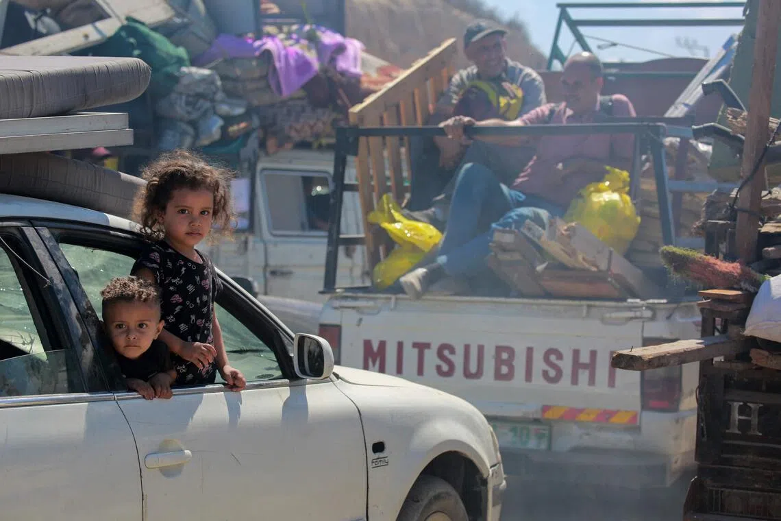 Palestinians heading south with their belongings, in Gaza on Oct 1.