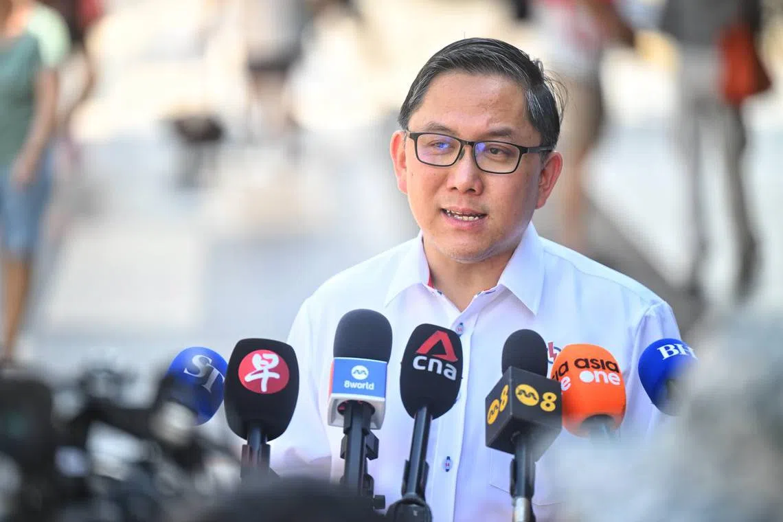 PAP candidate for Marsiling-Yew Tee GRC Alex Yam speaking to the media after a walkabout in Yew Tee on April 25.