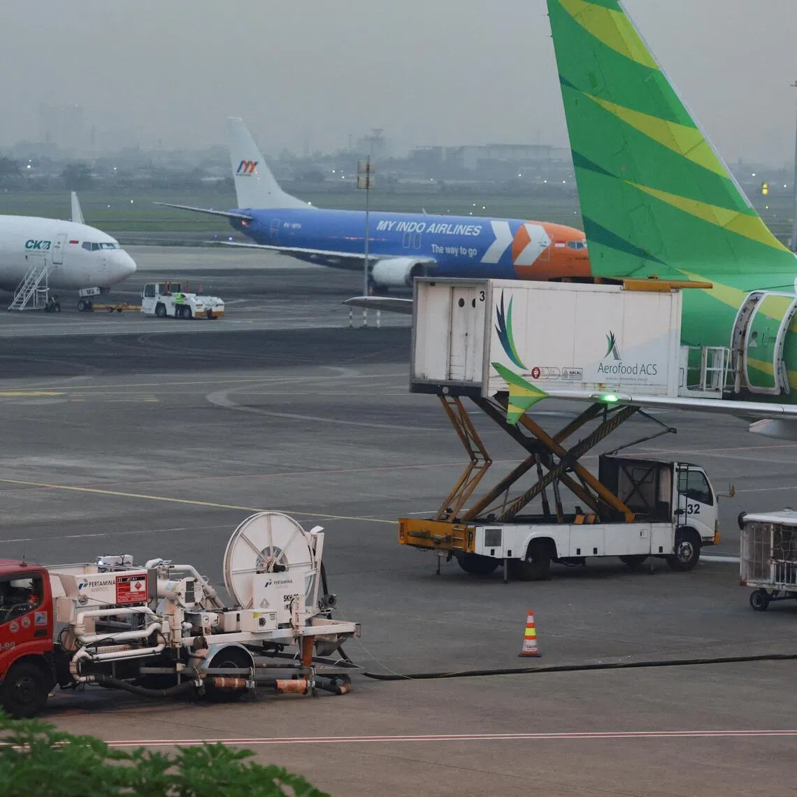 A truck refuels a Citilink Airbus at Soekarno-Hatta International Airport following the government approval of the jet fuel surcharge, amid the U.S.-Israeli conflict with Iran, in Tangerang, on the outskirts of Jakarta, Indonesia, April 6, 2026.