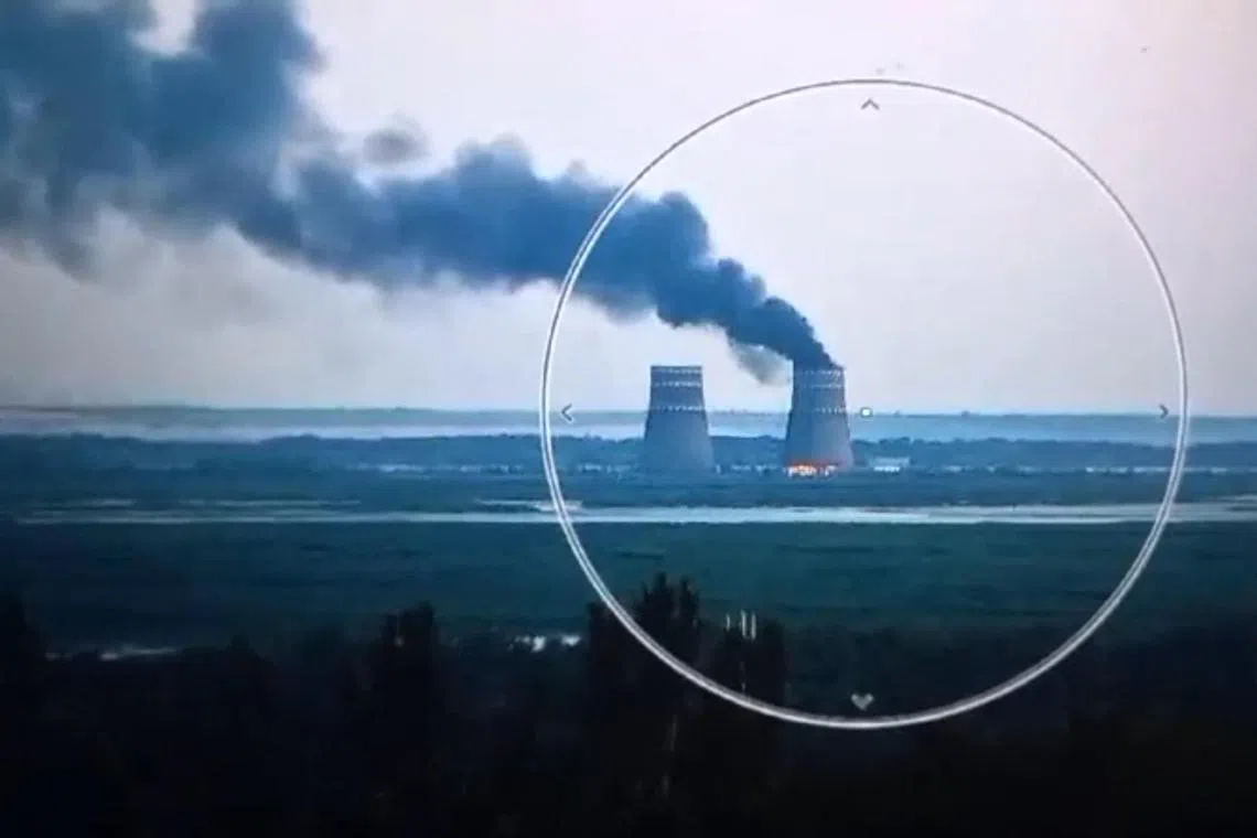 This video grab taken from a handout footage released by the Ukrainian Presidential Press Service on Aug 11  shows a fire at a cooling tower of the Russian-controlled Zaporizhzhia nuclear power plant in Energodar, Southern Ukraine. 