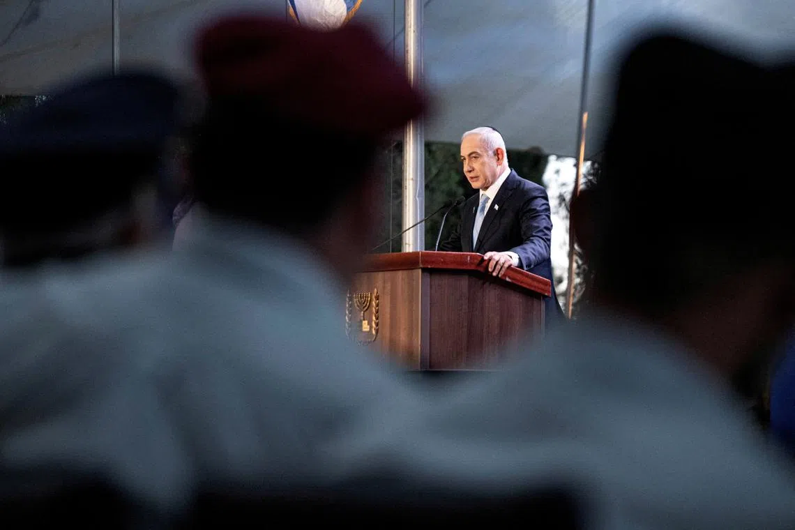FILE PHOTO: Israeli Prime Minister Benjamin Netanyahu speaks at a state memorial ceremony for Zeev Jabotinsky, founder of the Revisionist Zionist movement, amid the ongoing Israel-Hamas conflict at Mount Herzl military cemetery in Jerusalem, August 4, 2024. Naama Grynbaum/Pool via REUTERS/File Photo