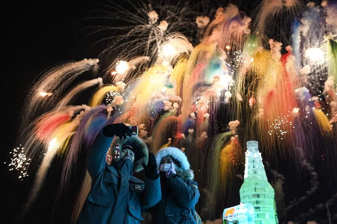 Visitors enjoying the fireworks during the opening ceremony of the 42nd Harbin China International Ice and Snow Festival at Harbin in northeastern Chinas Heilongjiang province on Jan 5, 2026. 