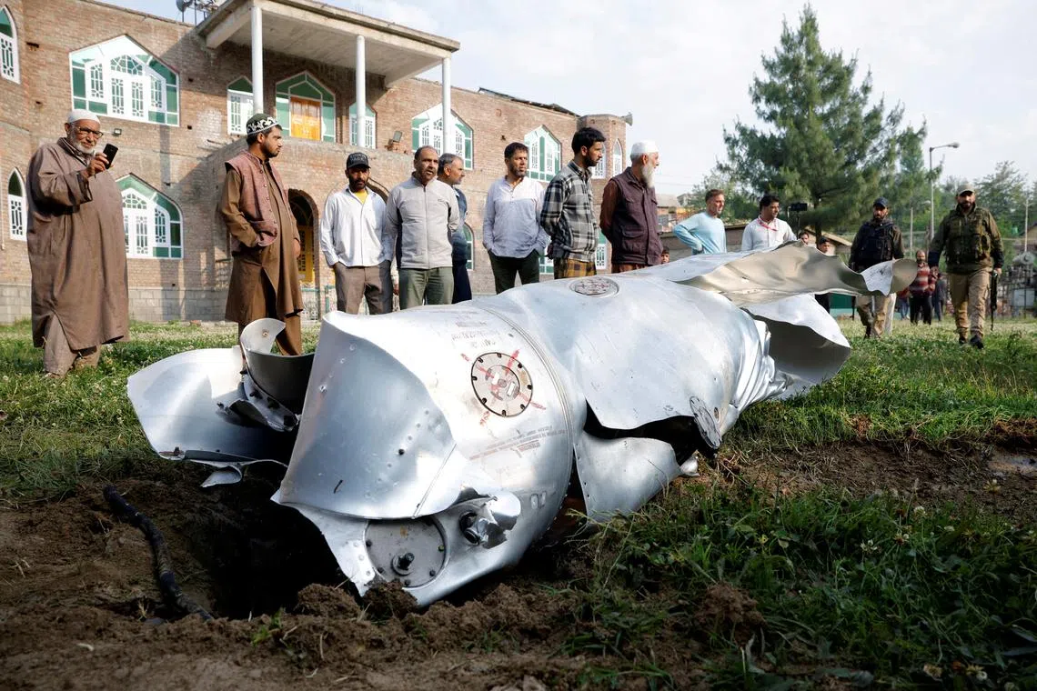 Metal debris on the ground in Wuyan in India-administered Kashmir's Pulwama district, on May 7, 2025. 