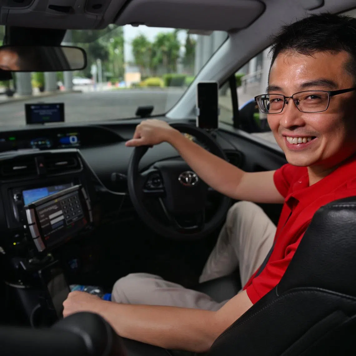 Vlogger and taxi driver Edward Jui (LazyCabbie) in his taxi.