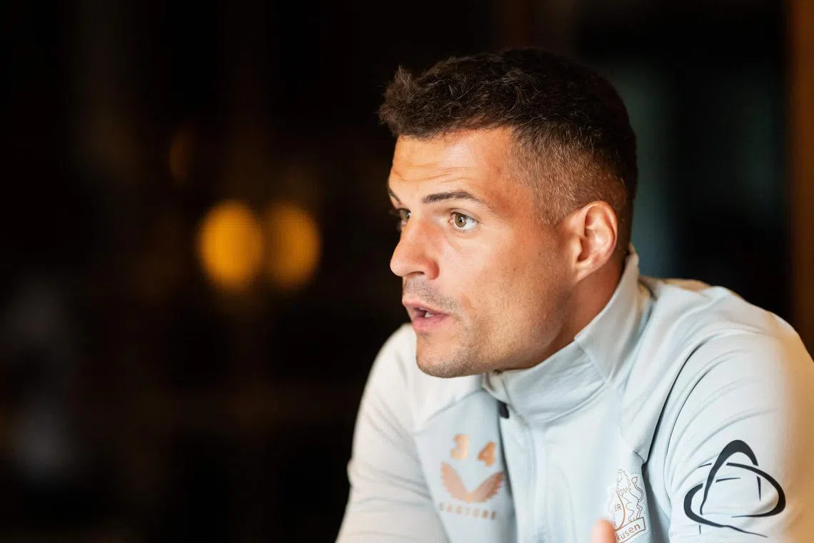 Bayer Leverkusen's Swiss midfielder Granit Xhaka has become an influential player at the German Bundesliga champions, which is far different from his time at Arsenal.