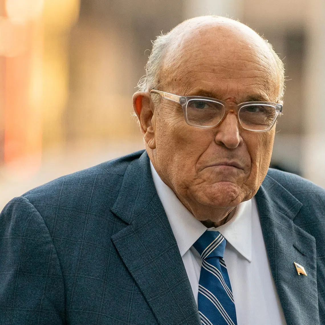FILE PHOTO: Former New York City Mayor and former lawyer for U.S. President-elect Donald Trump, Rudy Giuliani walks outside United States District Court in Manhattan, where a judge will consider a request by two Georgia election workers to whom he owes $148 million for defamation to hold him in civil contempt for failing to turn over his assets, in New York City, U.S., January 3, 2025.  REUTERS/David Dee Delgado/File Photo