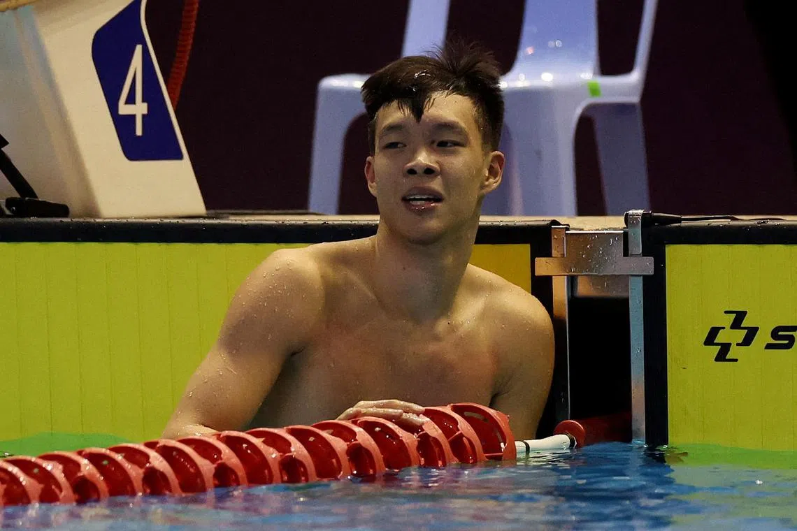 Singapore's Mikkel Jun Jie Lee reacting after winning the men's 50m butterfly final.