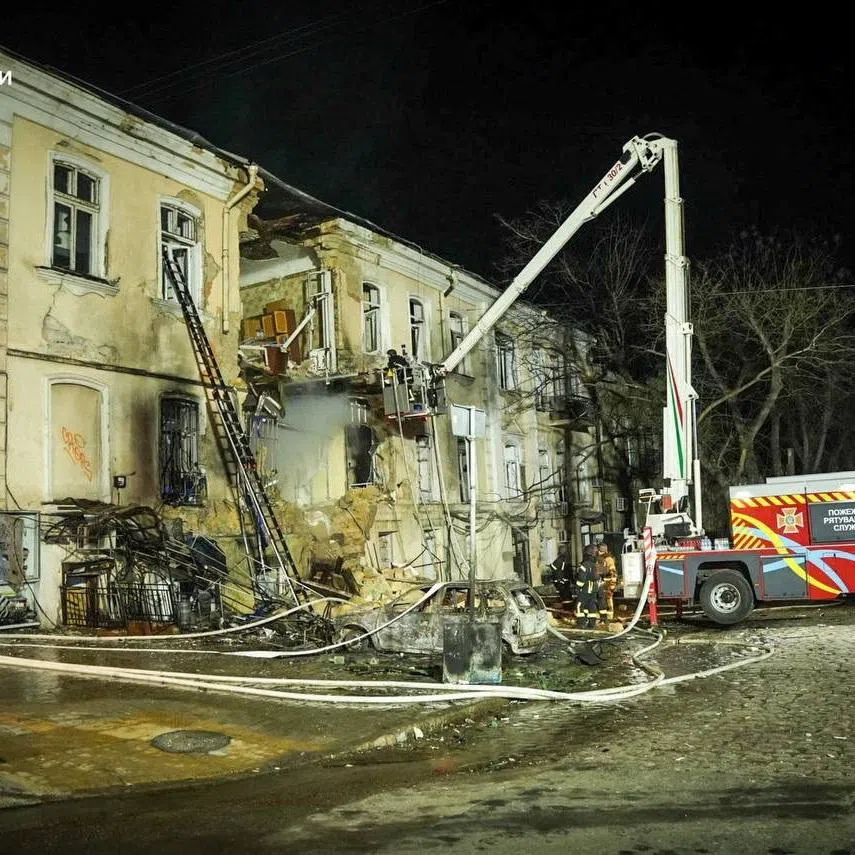 Rescuers work at the site of an apartment building hit by a Russian drone strike, amid Russia's attack on Ukraine, in Odesa, Ukraine in this handout picture released March 19, 2026. Press service of the State Emergency Service of Ukraine in Odesa region/Handout via REUTERS