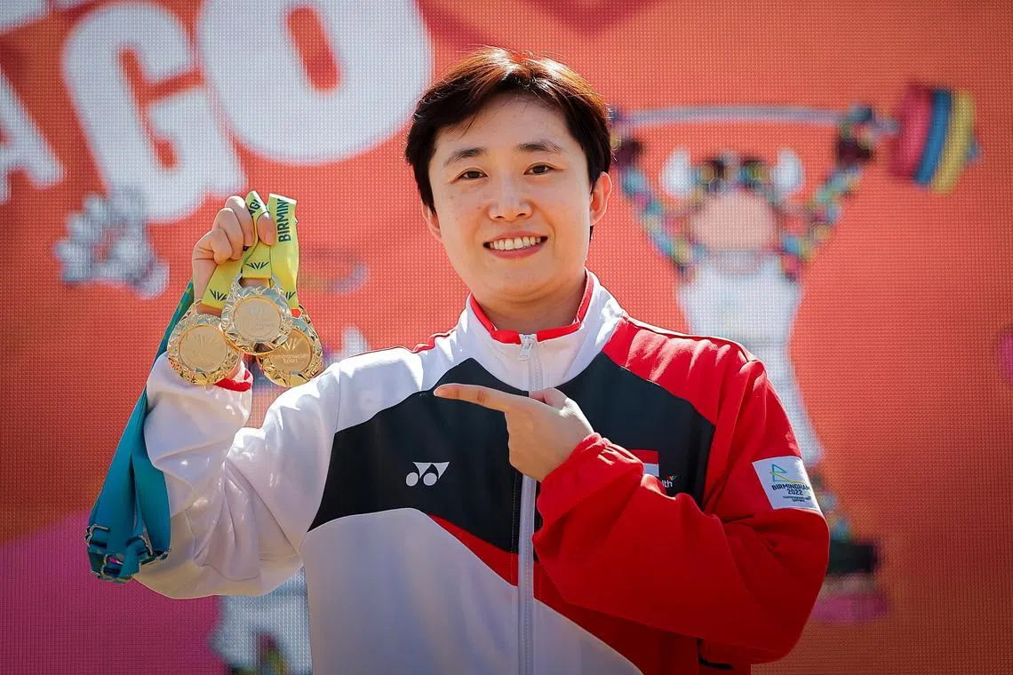 Singapore table tennis player Feng Tianwei posing with her medals at the Birmingham Commonwealth Games in 2022. 