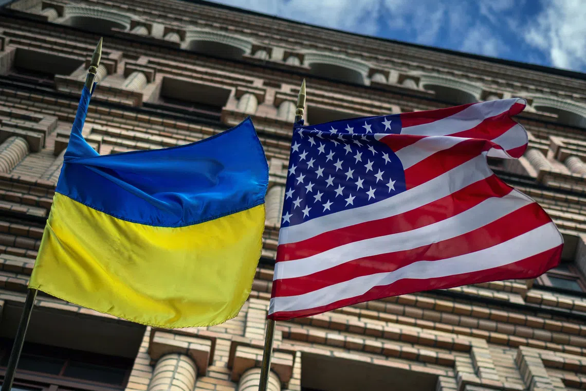 The Ukrainian and US national flags fly outside a building, amid Russia's attack on Ukraine, in Kyiv, Ukraine, in May.