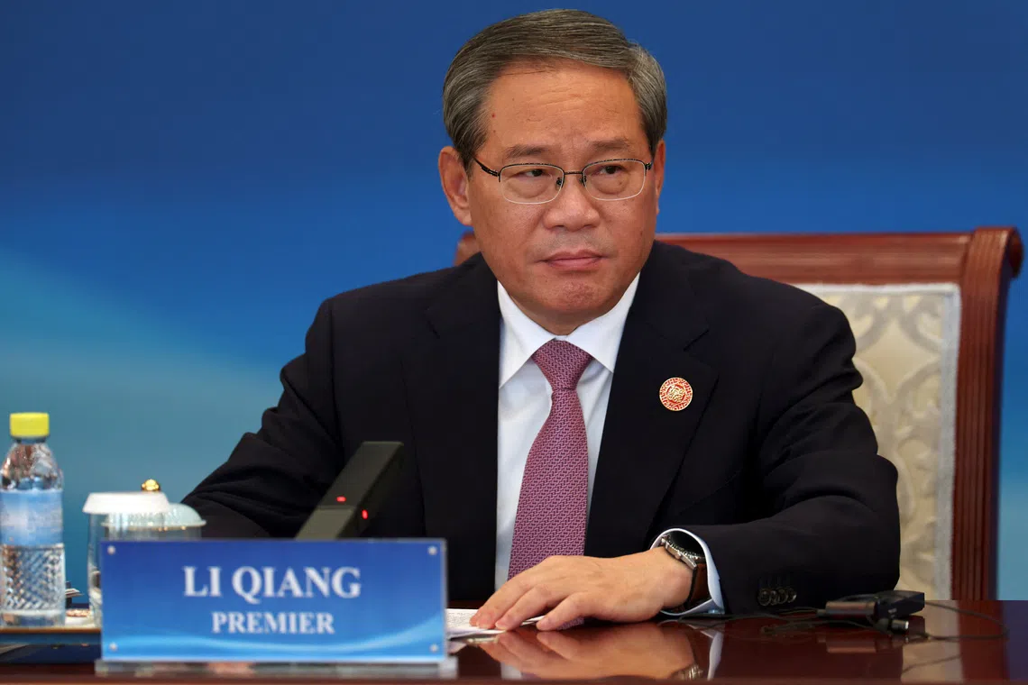 Chinese Premier Li Qiang attends the “1+10 Dialogue” with heads of key economic groups in Beijing on Dec 9.