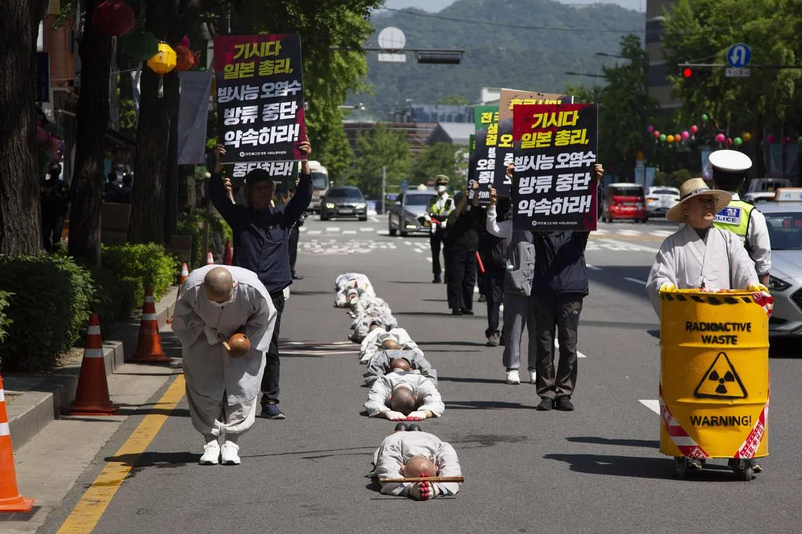 South Korean monks performing the Buddhist praying act of Dharna - walking three steps and making one bow, to protest against Japan's disposal of Fukushima radioactive water during a rally against the visit of the Japanese prime minister in Seoul, South Korea, 08 May 2023. 
