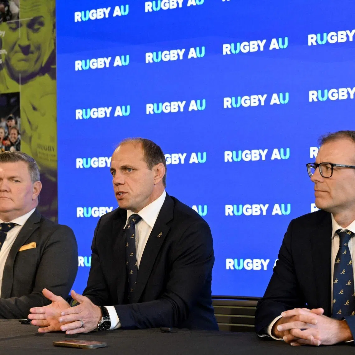 From left: Rugby Australia chair Dan Herbert, chief executive Phil Waugh and chief operating officer Richard Gardham at a press conference in Sydney on April 22, 2026, following the organisation’s annual general meeting.