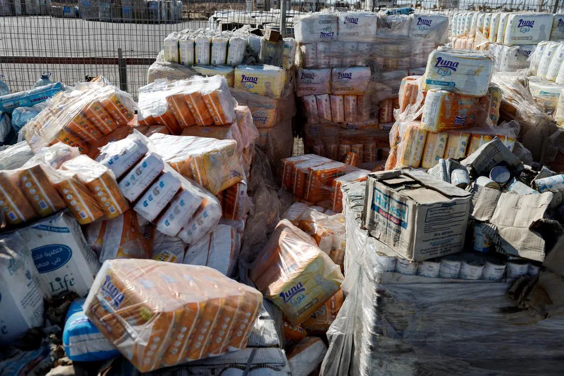 FILE PHOTO: Parcels of humanitarian aid await transfer into Gaza, at the Gaza side of the Kerem Shalom crossing in the Gaza Strip, July 24, 2025. REUTERS/Amir Cohen/File Photo
