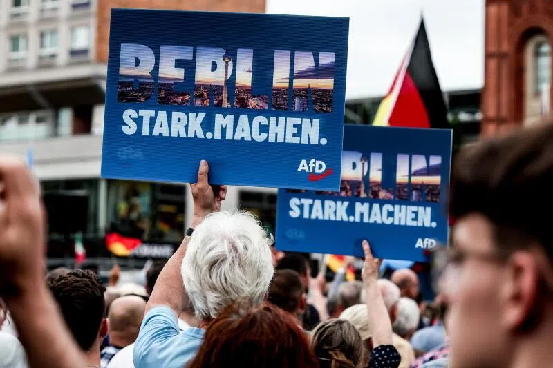 Supporters of the far-right Alternative for Germany (AfD) party holding signs saying ‘Make Berlin Strong’ during a rally on June 29 in front of the Berlin City Hall.