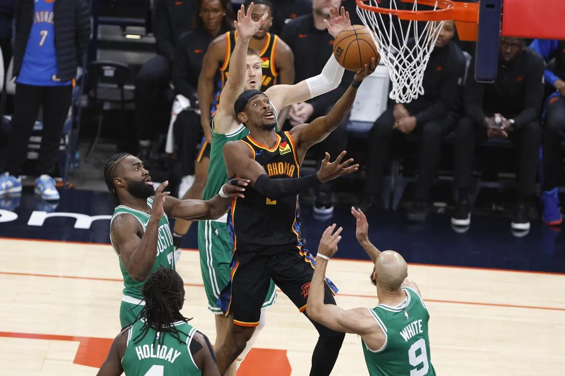 Oklahoma City Thunder guard Shai Gilgeous-Alexander shooting the ball while being defended by Boston Celtics guard Jaylen Brown (No. 7) during the first quarter at Paycom Centre on Jan 5. Gilgeous-Alexander scored 33 points in his team's 105-92 win on Jan 5.