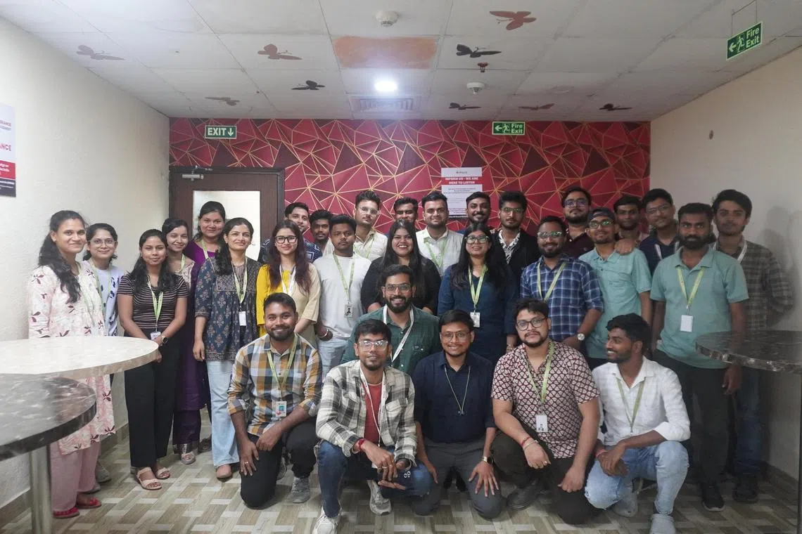 rmai - Dentist Sushovan Das, 28, (sitting row, third from left) leads a team in AI data services company iMerit's Salt Lake office in West Bengal. The team trains medical AI models to read X-rays and summarise medical reports for AI data services company

Credit: iMerit
