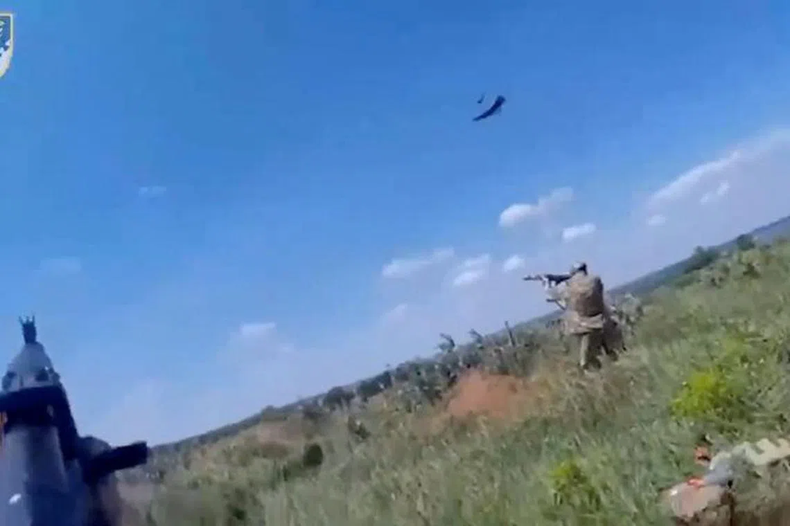 FILE PHOTO: Ukrainian soldiers shoot at what a source from Ukraine's Presidential Office says are Lancet drones, in this still image taken from handout video released on May 31, 2023.  Defence Ministry Of Ukraine/Handout via REUTERS/File Photo