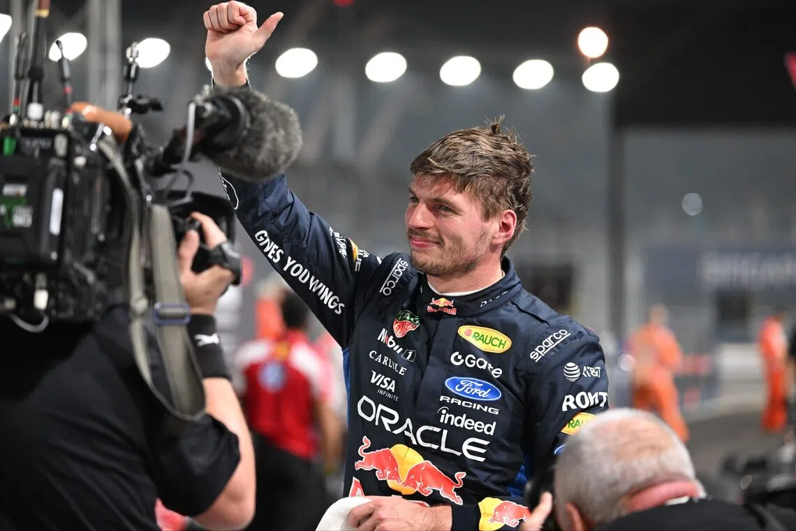 Red Bull’s Max Verstappen celebrating taking pole position for the Singapore Grand Prix on Oct 10 at the Marina Bay Street Circuit.