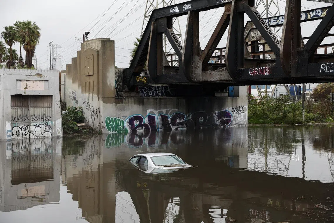 Pacific storm douses California, flooding roads, in first of one-two ...
