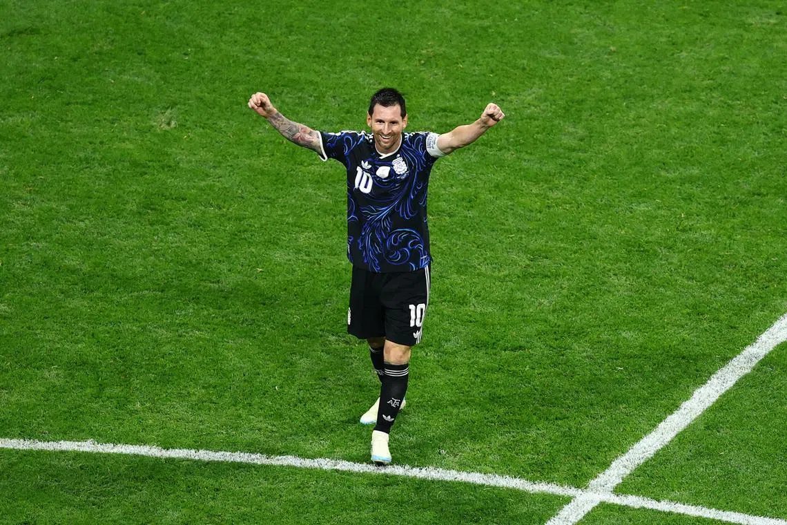 Argentina’s Lionel Messi celebrates after the semi-final match against England as they advance to the World Cup final.