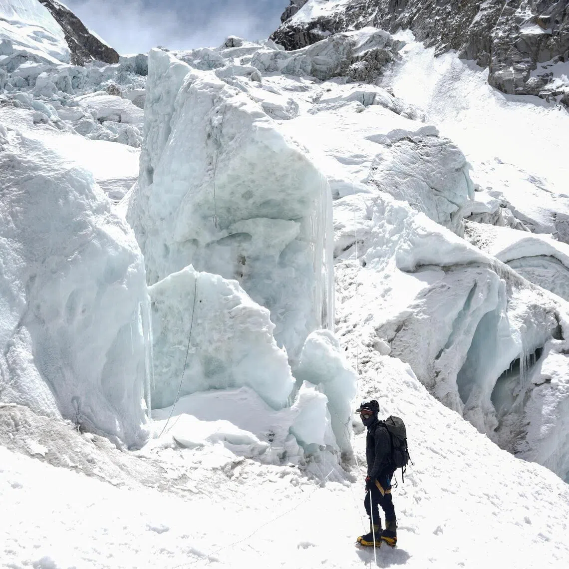 A member of expedition team stands at Khumbu Icefall, as the route to Mount Everest Camp One has not yet been opened for the season in Solukhumbu district, also known as the Everest region, Nepal, April 22, 2026. REUTERS/Purnima Shrestha