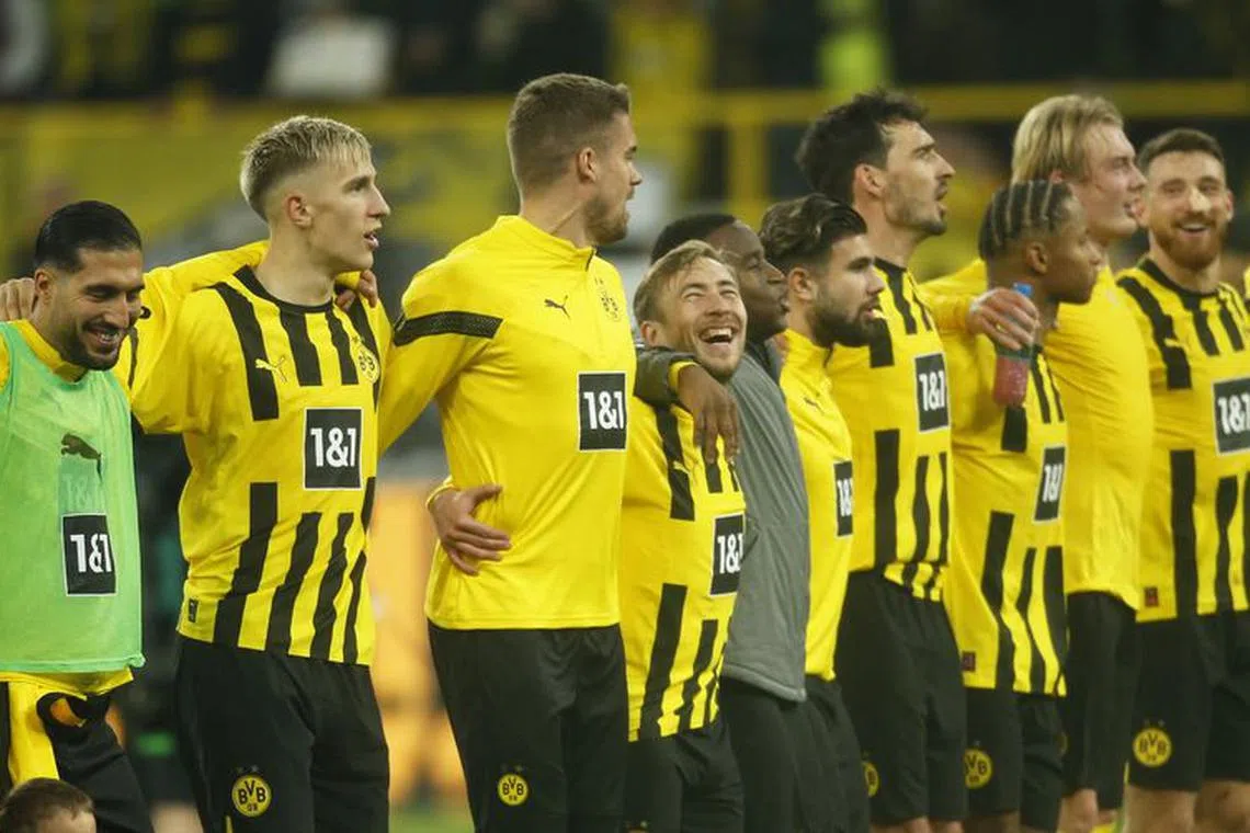 FILE PHOTO: Soccer Football - Bundesliga - Borussia Dortmund v VfL Bochum - Signal Iduna Park, Dortmund, Germany - November 5, 2022  Borussia Dortmund's Emre Can and Nico Schlotterbeck celebrate with teammates after the match REUTERS/Leon Kuegeler/File Photo