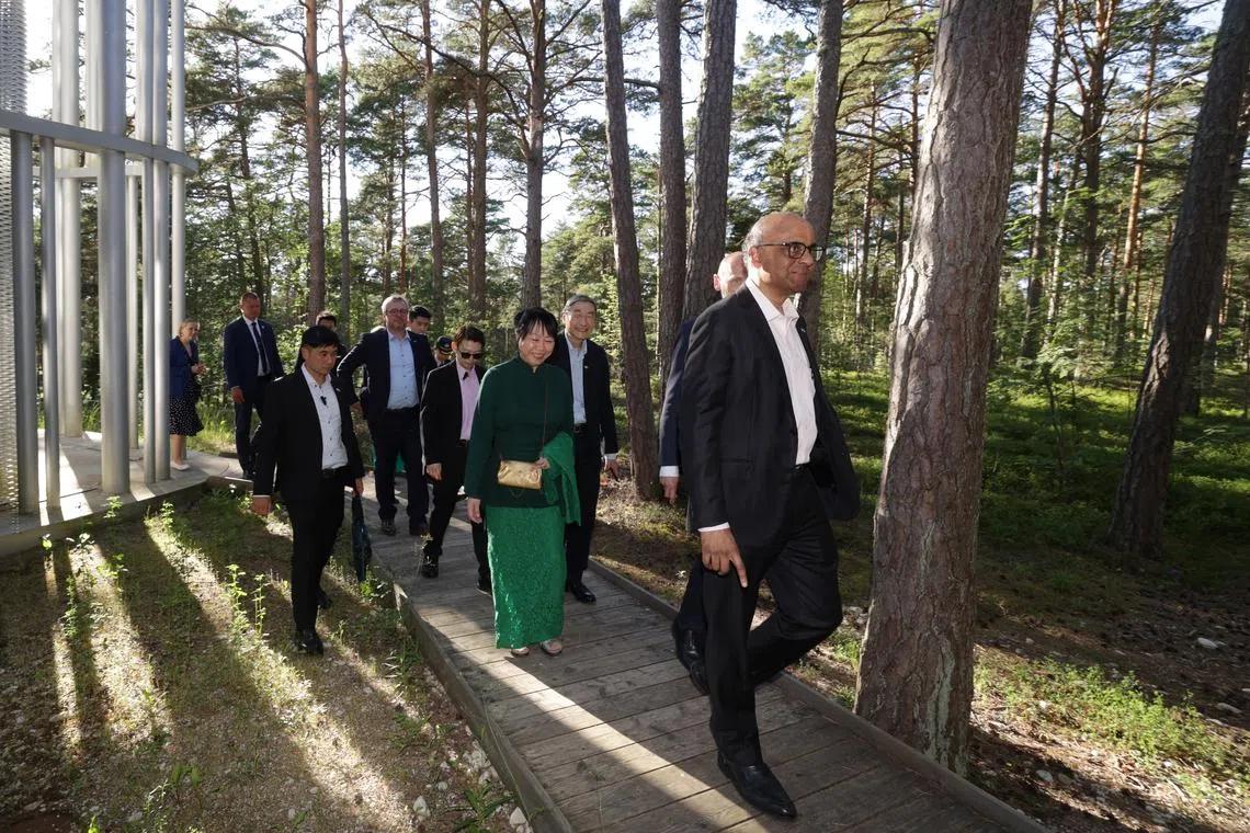 President Tharman Shanmugaratnam (right) and his spouse, Ms Jane Ittogi (centre), tour the Arvo Part Centre in Tallinn, on June 26.