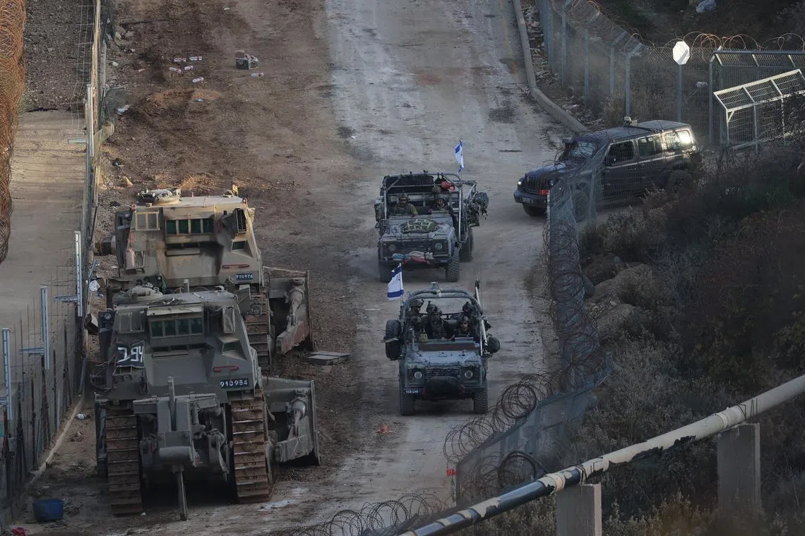 Israeli troops at the border with Syria near the Druze village of Majdal Shams, in the Israeli-annexed Golan Heights on Dec 9.