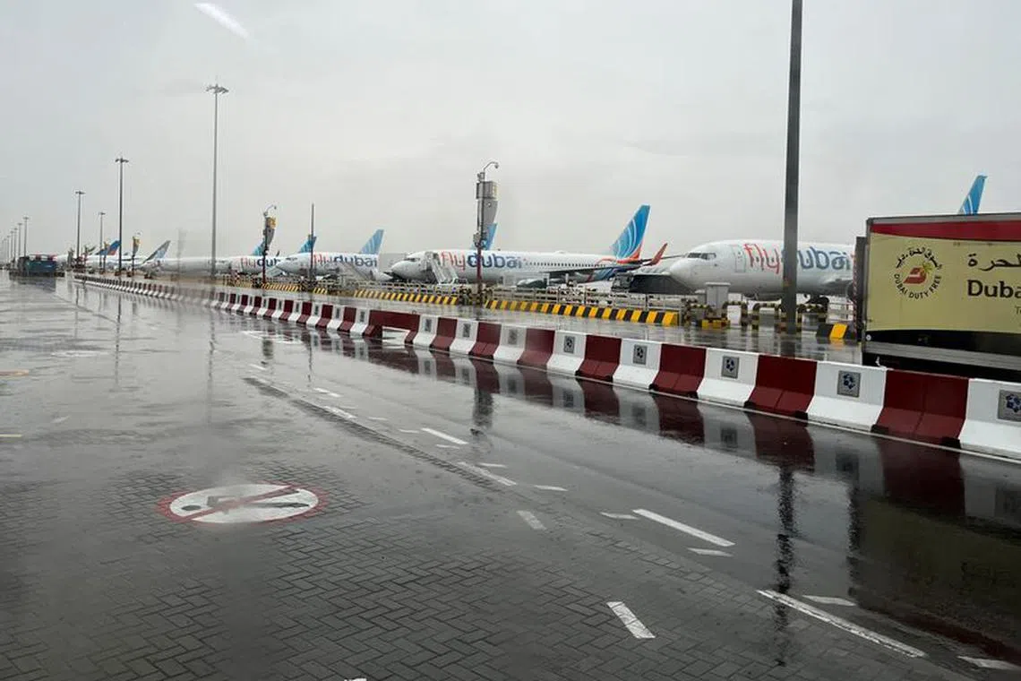 A general view from inside a bus of flydubai aircraft at Dubai International Airport, Dubai, United Arab Emirates November 17, 2023. REUTERS/Alexander Cornwell