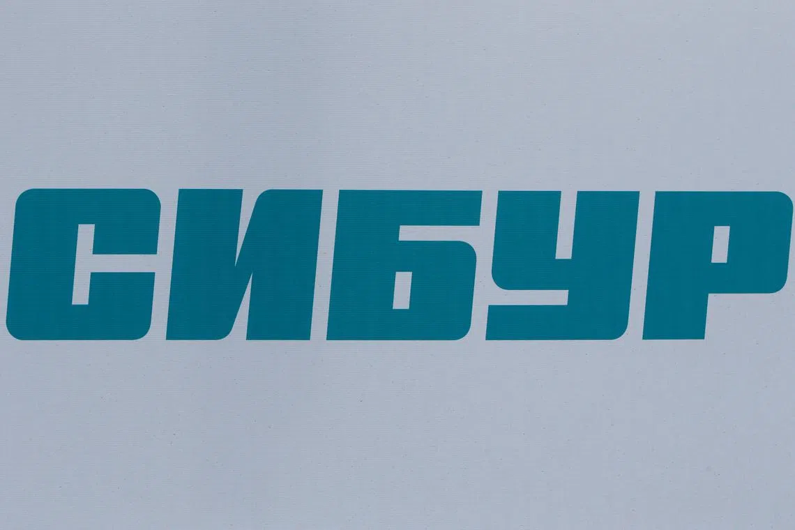 FILE PHOTO: The logo of Russian petrochemical company Sibur is seen on a board at the St. Petersburg International Economic Forum 2017 (SPIEF 2017) in St. Petersburg, Russia, June 1, 2017. Picture taken June 1, 2017. REUTERS/Sergei Karpukhin/File Photo