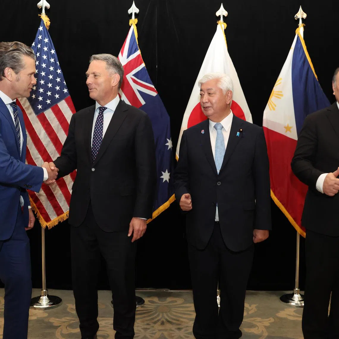 epa12146728 (L-R) US Defense Secretary Pete Hegseth, Australia’s Deputy Prime Minister and Minister for Defence Richard Marles, Japan’s Minister of Defense Nakatani Gen, and Philippines Secretary of National Defense Gilberto Teodoro Jr. shake hands with each other following their multilateral meeting on the sidelines of the International Institute for Strategic Studies (IISS) Shangri-La Dialogue Defence Summit in Singapore, 31 May 2025. Defense ministers and officials from 47 countries are gathered in the city-state for the IISS Shangri-La Dialogue, an annual high-level defense summit in the Asia-Pacific region.  EPA-EFE/HOW HWEE YOUNG