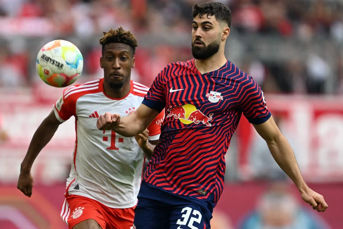 Bayern Munich's French midfielder Kingsley Coman (L) and Leipzig's Josko Gvardiol vie for the ball during the German first division Bundesliga football match between FC Bayern Munich and RB Leipzig in Munich, southern Germany, on May 20, 2023. (Photo by Christof STACHE / AFP) / DFL REGULATIONS PROHIBIT ANY USE OF PHOTOGRAPHS AS IMAGE SEQUENCES AND/OR QUASI-VIDEO