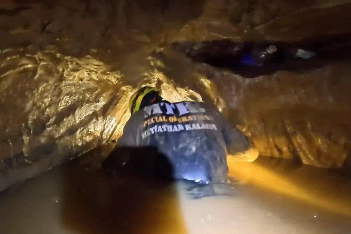 A rescuer working to save people trapped in a cave in Laos on May 25.