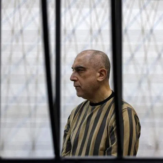 Former head of political security in Syria's Daraa province, Atif Najib attending the first trial session at the Palace of Justice, in Damascus on April 26, 2026.