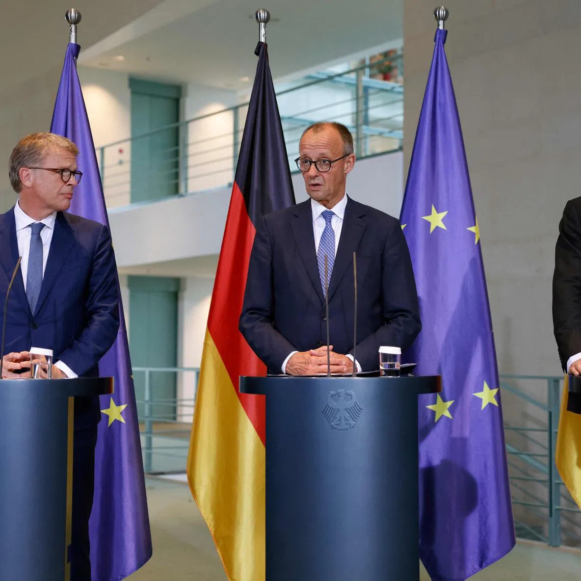 German Chancellor Friedrich Merz (centre) with Deutsche Bank CEO Christian Sewing (left) and Siemens CEO Roland Busch at the launch of the “Made for Germany” initiative in Berlin on July 21.