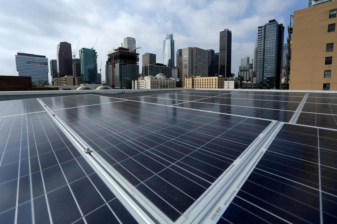 FILE PHOTO: Solar electric panels are shown installed on the roof of the Hanover Olympic building in Los Angeles, California, U.S., June 6, 2017. REUTERS/Mike Blake/File Photo