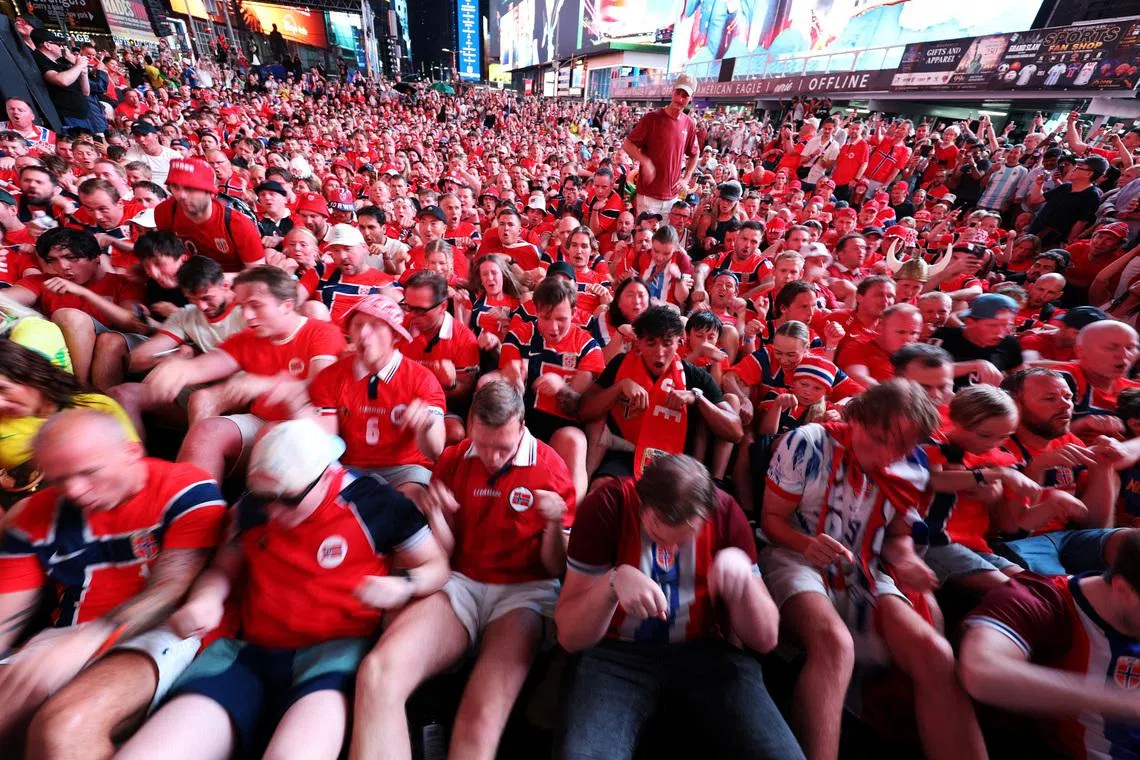 Soccer Football - FIFA World Cup 2026 - Norway fans perform their trademark Viking Row in Times Square - New York City, New York, U.S. - July 3, 2026 Norway fans perform the 'Viking Row' celebration at Times Square in New York City REUTERS/John Sibley