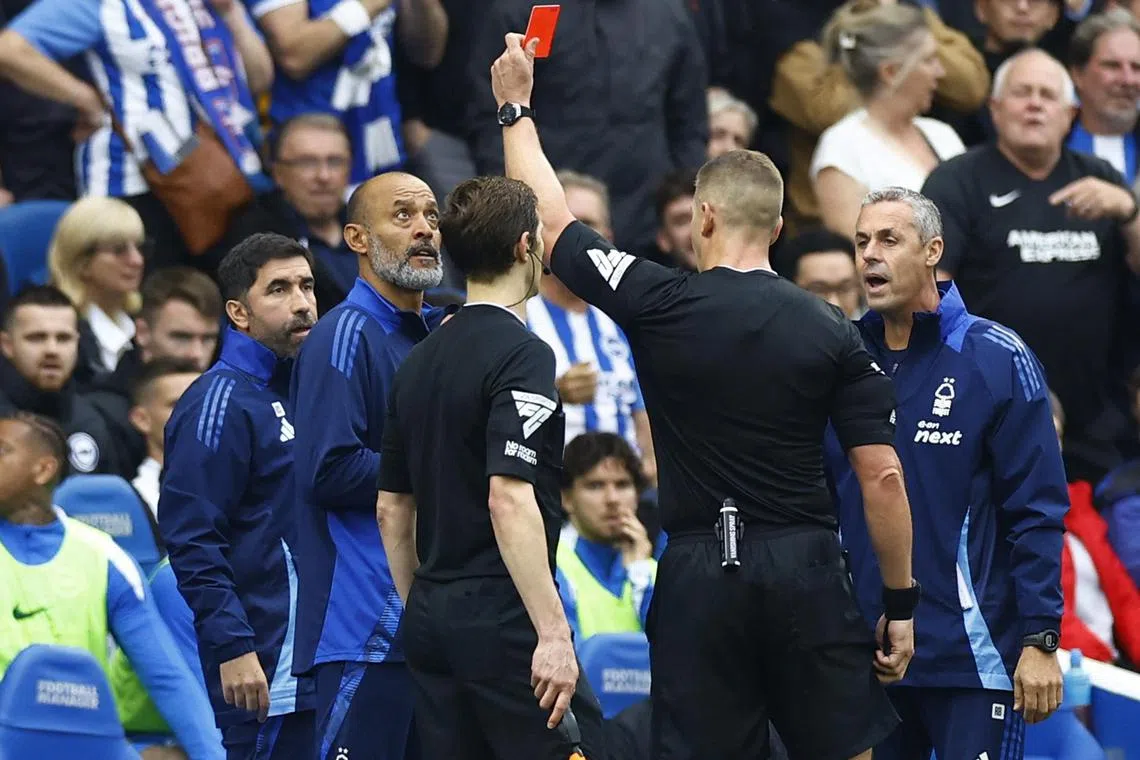 Nottingham Forest manager Nuno Espirito Santo being shown a red card by referee Robert Jones during his side's 2-2 English Premier League draw against Brighton & Hove Albion at The Amex on Sept 22. Brighton manager Fabian Hurzeler was also sent off.
