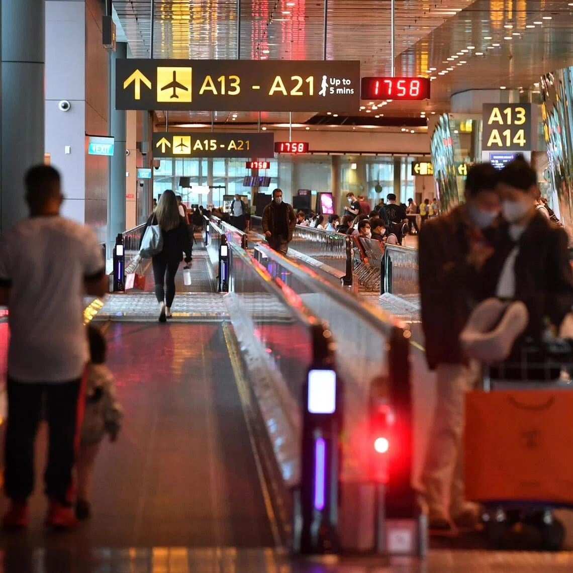 Passengers at the transit area of Terminal 3, Changi Airport on April 10, 2022.