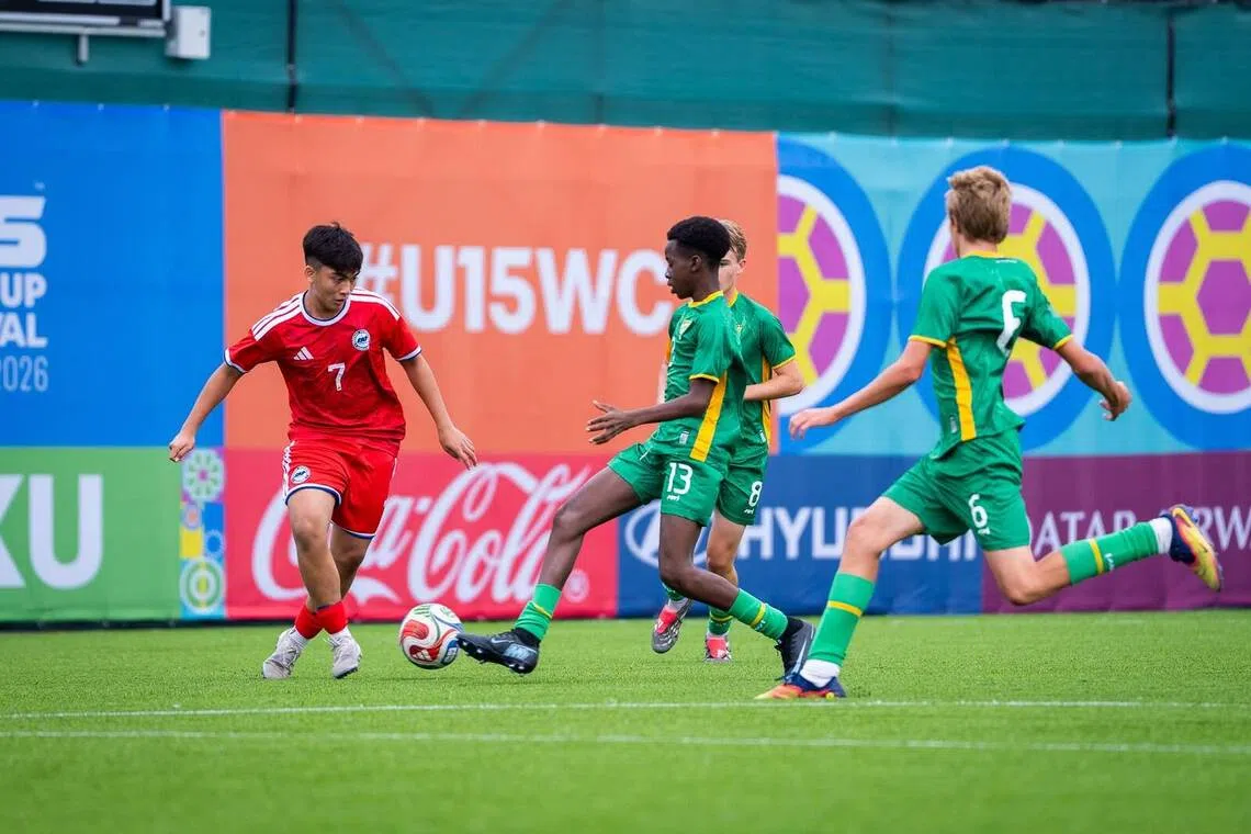 Singapore forward Adryan Alfian taking on players in their 9-0 win over the British Virgin Islands in the Tier E knockout stage of the inaugural FIFA Under-15 World Cup and Festival.