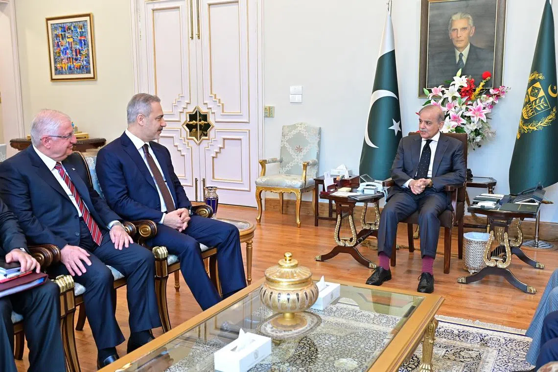 Turkey's Foreign Affairs Minister Hakan Fidan and National Defence Minister Yaşar Guler being received by Pakistan Prime Minister Shehbaz Sharif in Islamabad on July 9. 