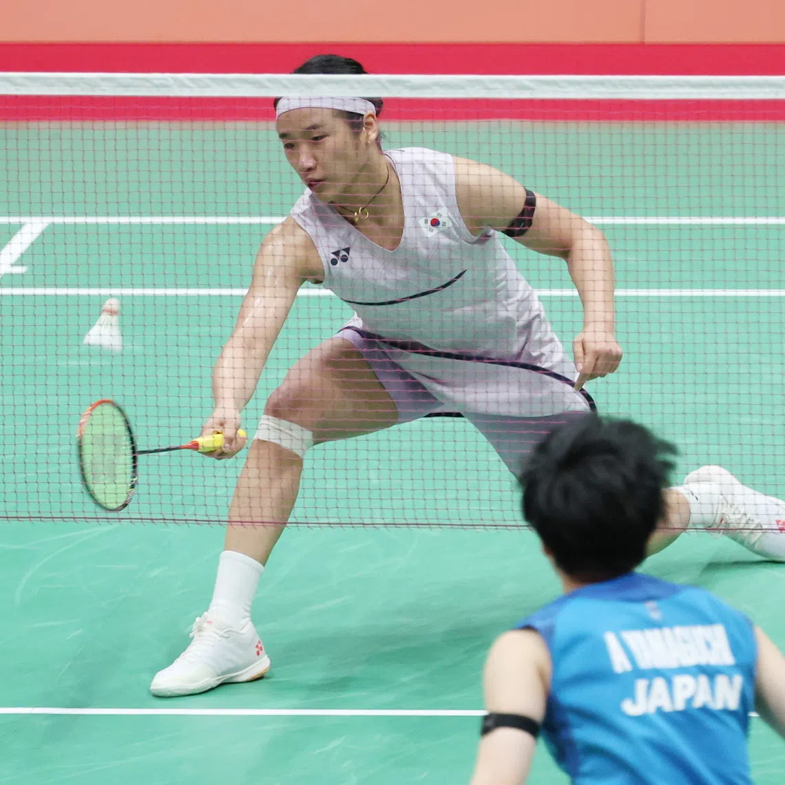 South Korea’s An Se-young returns a shot against Japan’s Akane Yamaguchi at the Asian Games team event semi-finals.
