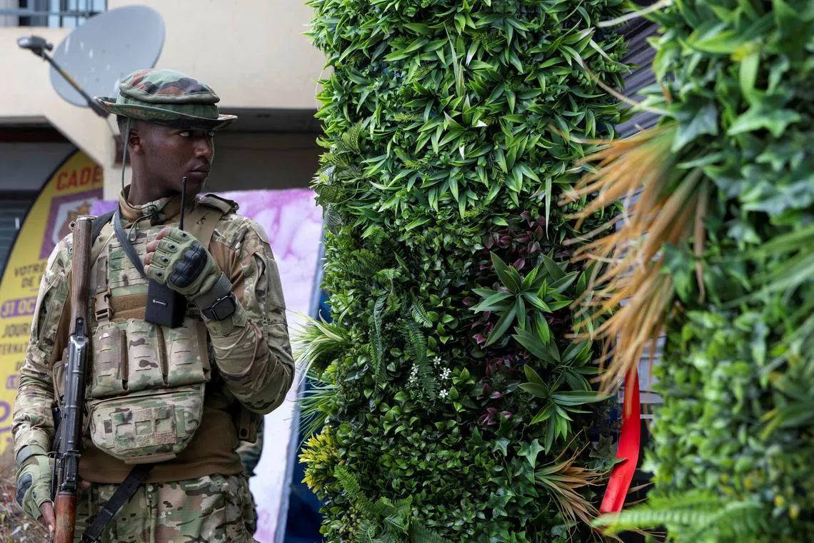 FILE PHOTO: A member of the M23 rebel group stands guard , in Goma, North Kivu province in the East of the Democratic Republic of Congo, April 7, 2025. REUTERS/Arlette Bashizi/File Photo