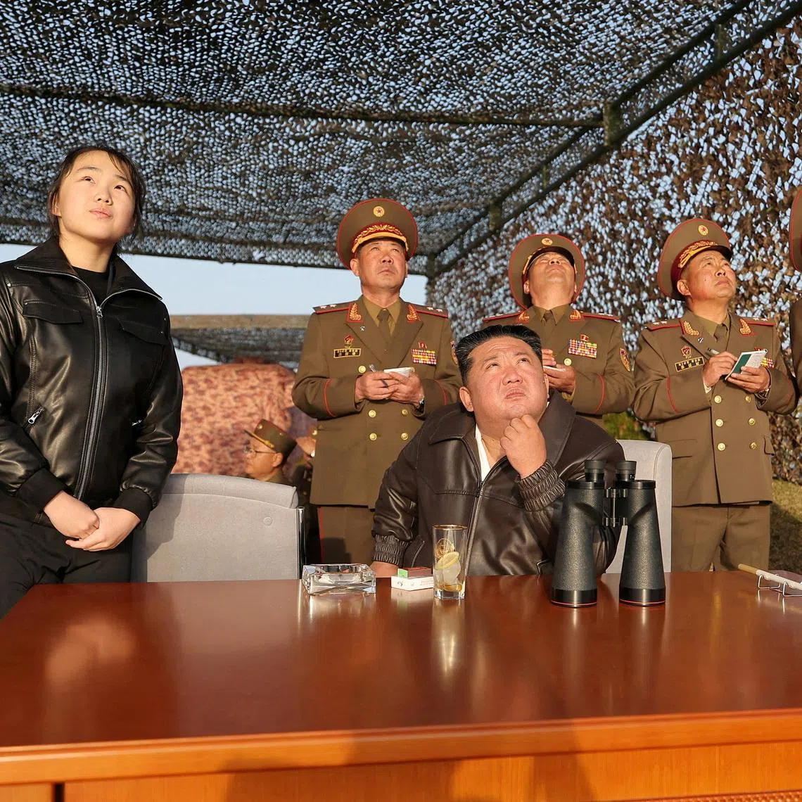 North Korean leader Kim Jong Un, accompanied by his daughter Ju Ae, oversees test launches on April 19.