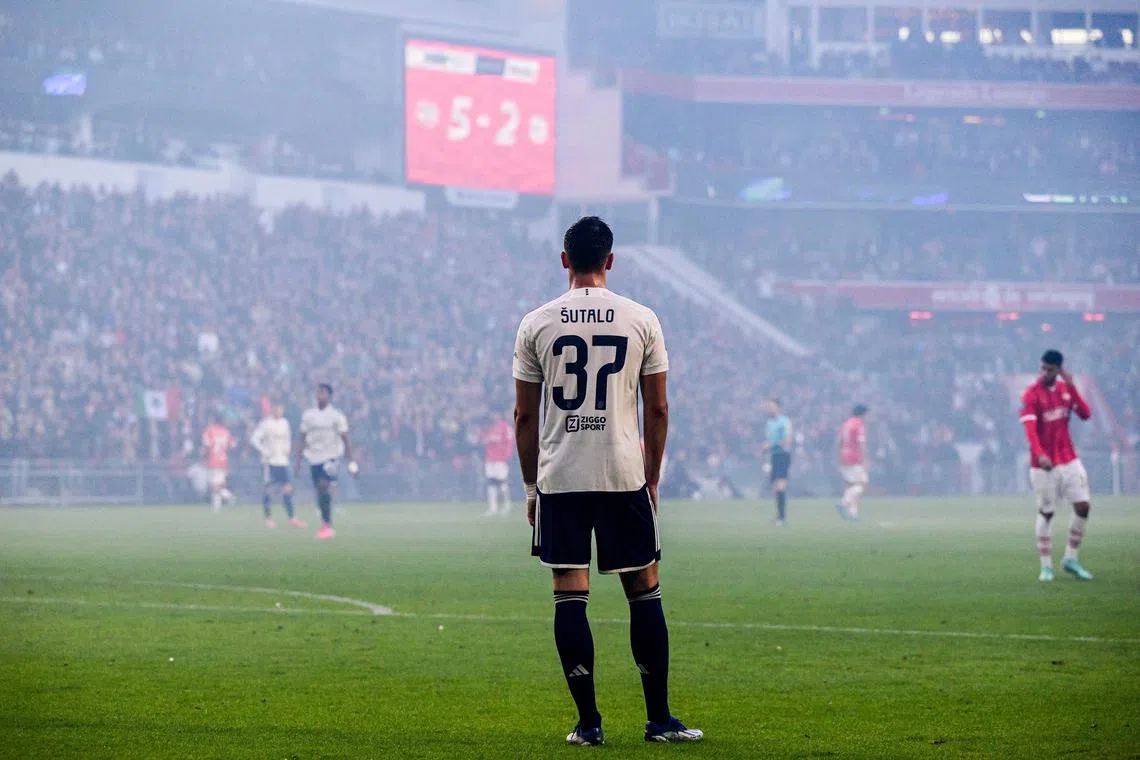 epa10948146 Josip Sutalo of Ajax is disappointed with the 5-2 score during the Dutch Eredivisie match between PSV Eindhoven and Ajax Amsterdam, in Eindhoven, the Netherlands, 29 October 2023.  EPA-EFE/OLAF KRAAK