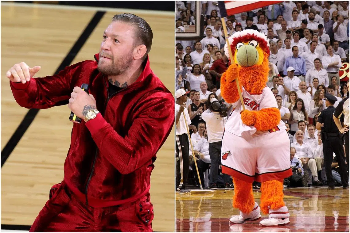 Miami Heat’s mascot Burnie (right) was swiftly knocked to the ground by Conor McGregor’s left hook. 